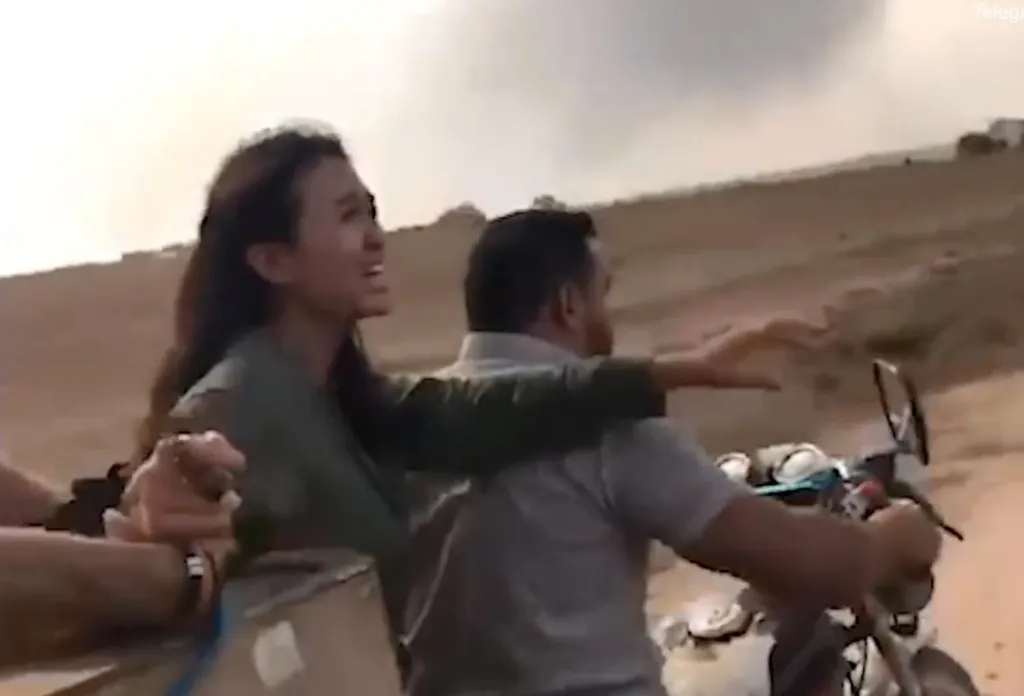 Noa Argamani being kidnapped by Hamas terrorists on a motorcycle.