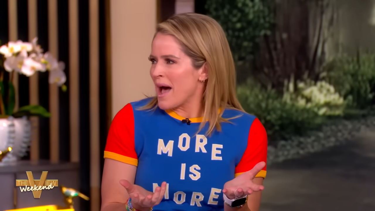 Sara Haines wearing a blue shirt that says 