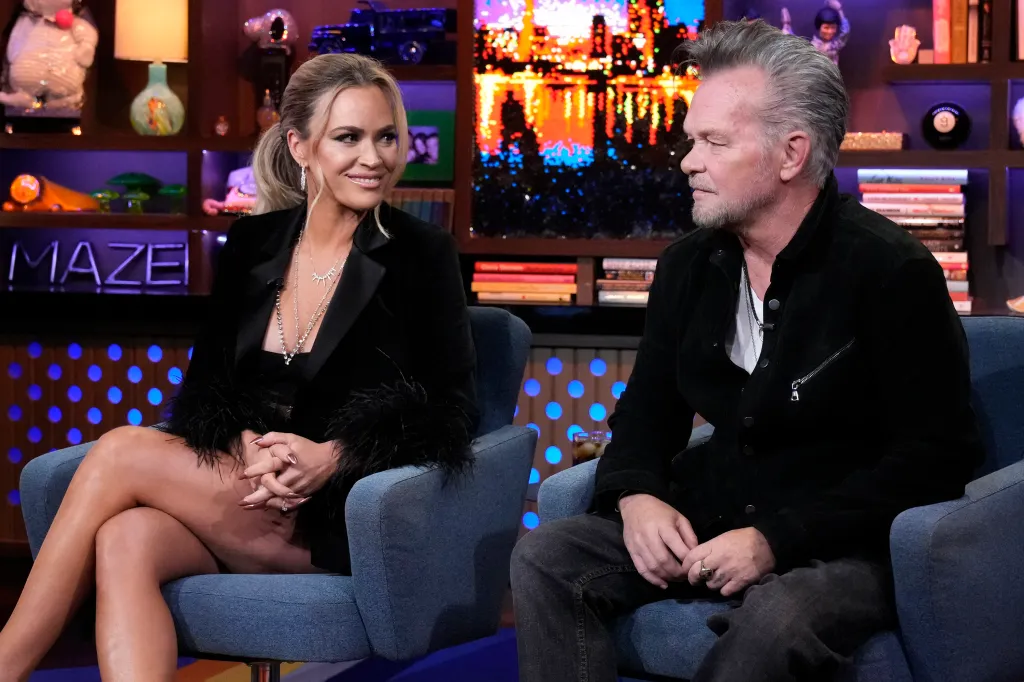 Teddi Mellencamp and John Mellencamp seated on a talk show set.