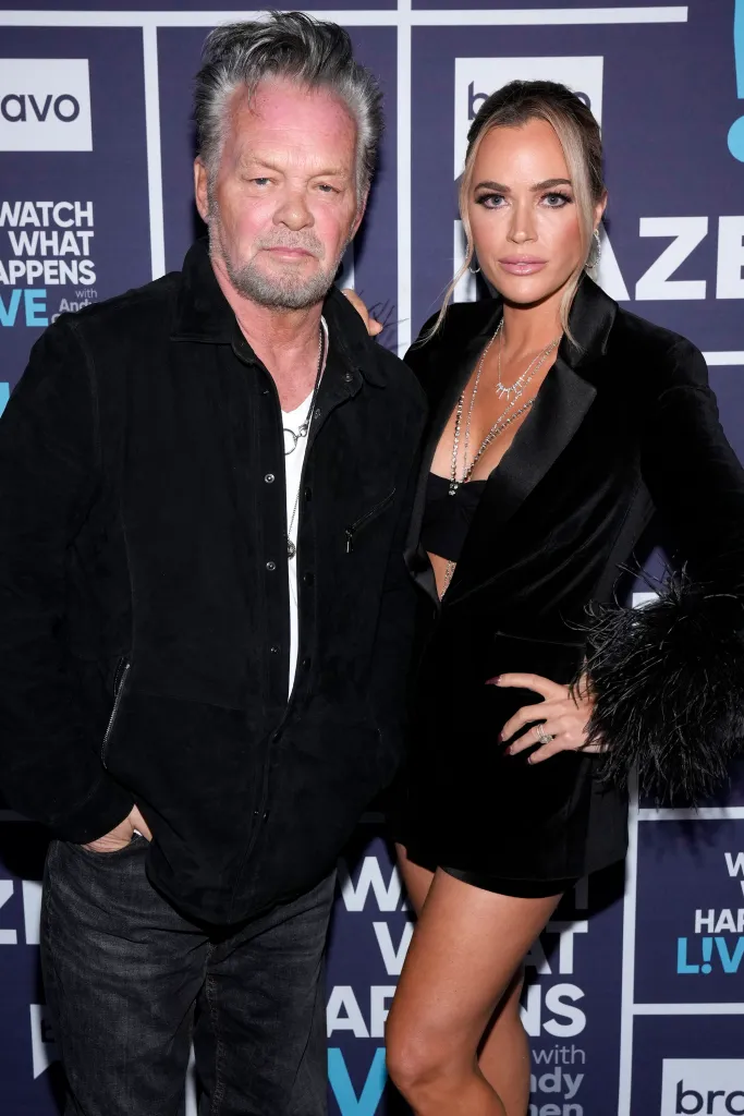 John Mellencamp and Teddi Mellencamp posing for a photo on the red carpet.