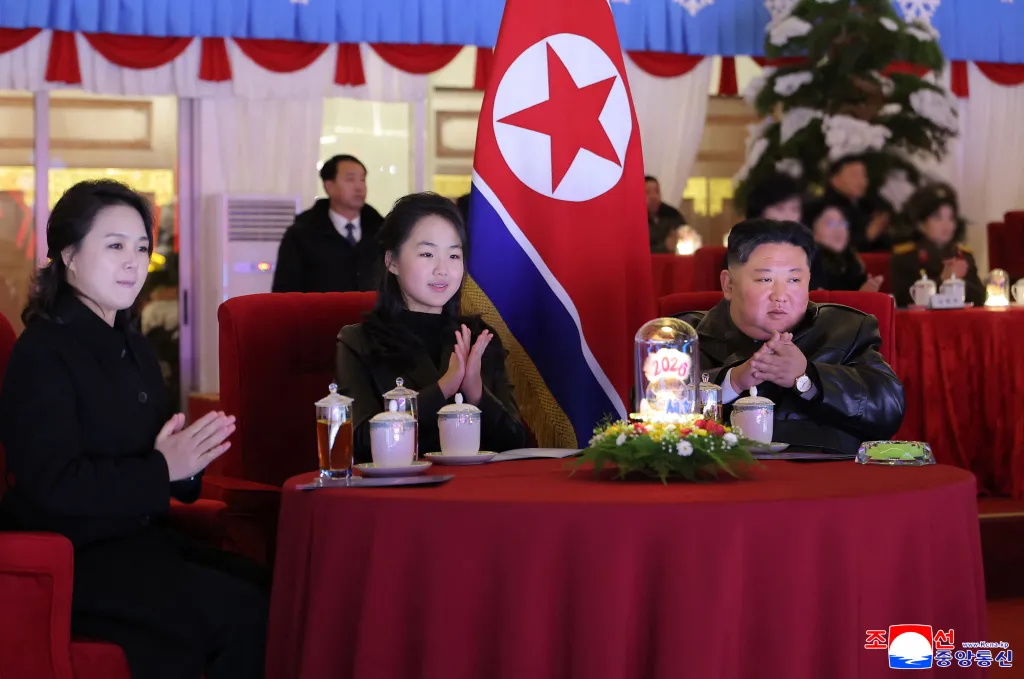 Kim Jong Un, his daughter Kim Ju Ae (C) and wife Ri Sol Ju (L) watching a New year's celebration performance at the May Day Stadium in Pyongyang on December 31, 2025.