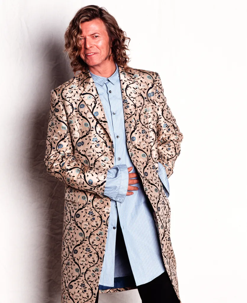 David Bowie wearing an Alexander McQueen coat at Glastonbury.