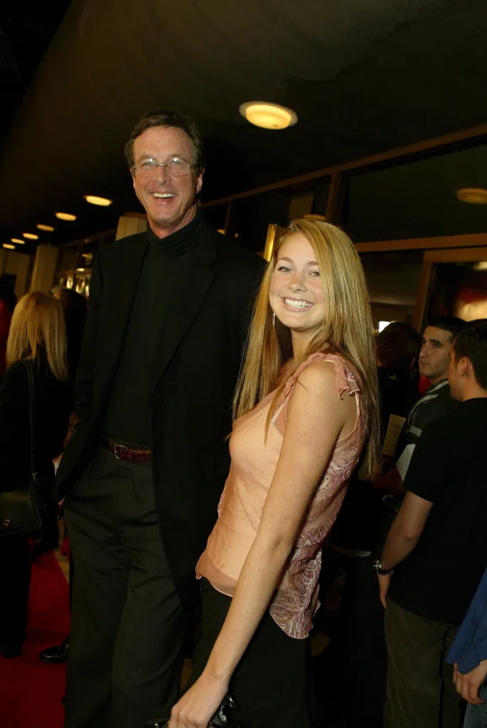 Michael Crichton and Taylor Crichton smiling at the world premiere of 