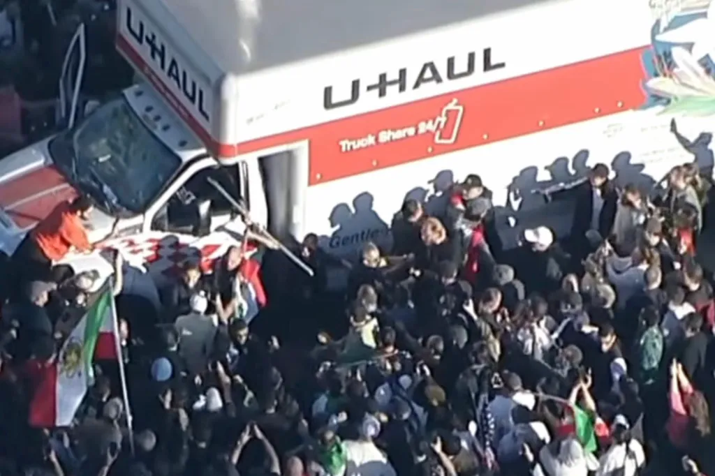 Protesters in Westwood, Los Angeles, attacking a U-Haul truck that drove through their crowd.