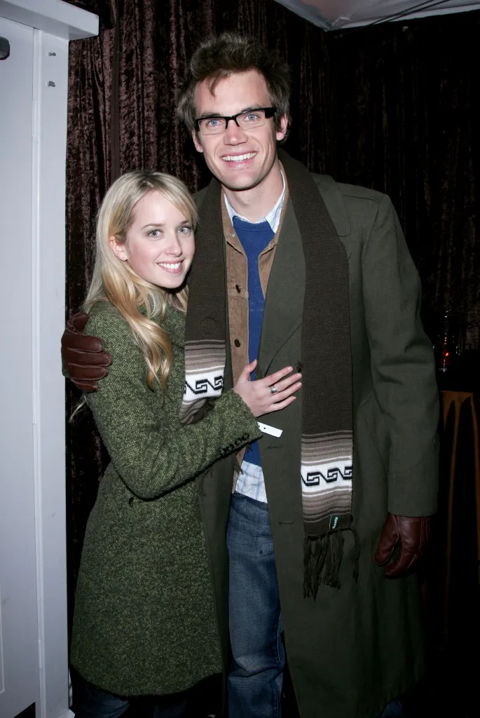 Megan Park and Tyler Hilton embracing at the William Morris Party.