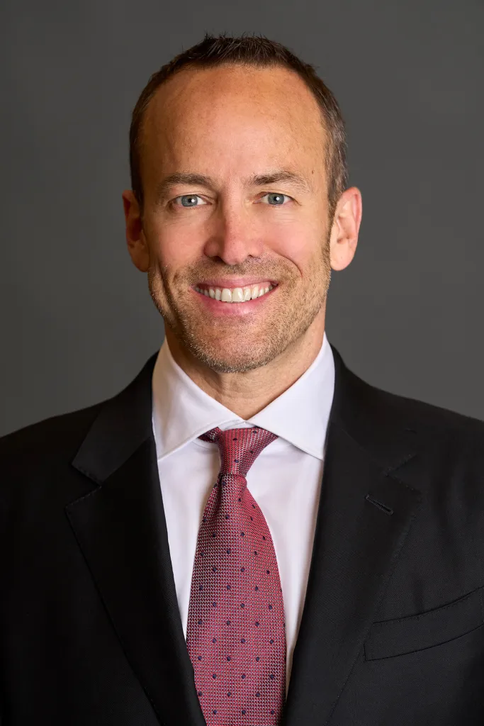A headshot of Winston Fisher smiling.