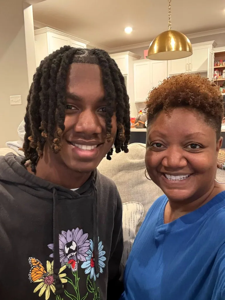 Jordan Hall smiling with his mother, Jacinta Hall.