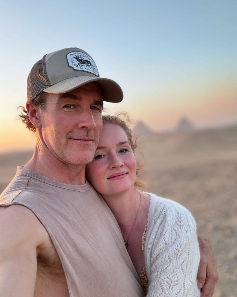 James Van Der Beek and his wife, Kimberly Van Der Beek, pose for a photo at sunset.