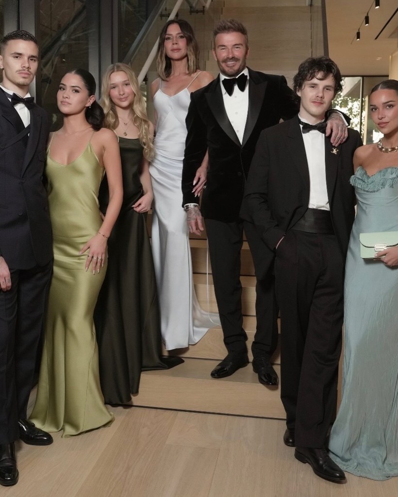 From left, Romeo Beckham, in a black tuxedo, Kim Turnbull in a green gown, Harper Beckham in a black gown, Victoria Beckham in a silver gown, David Beckham in a black tuxedo, Cruz Beckham in a black tuxedo, Jackie Apostel in a blue gown.