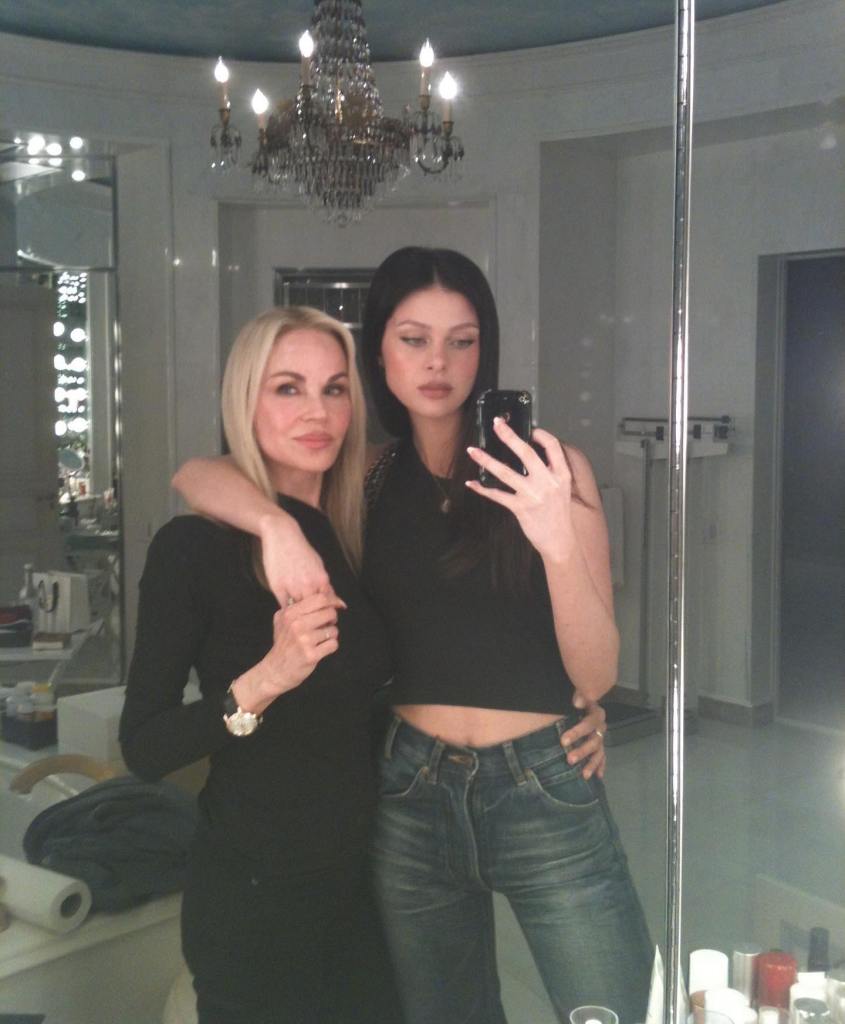 Nicola Peltz and her mother Claudia pose for a mirror selfie.