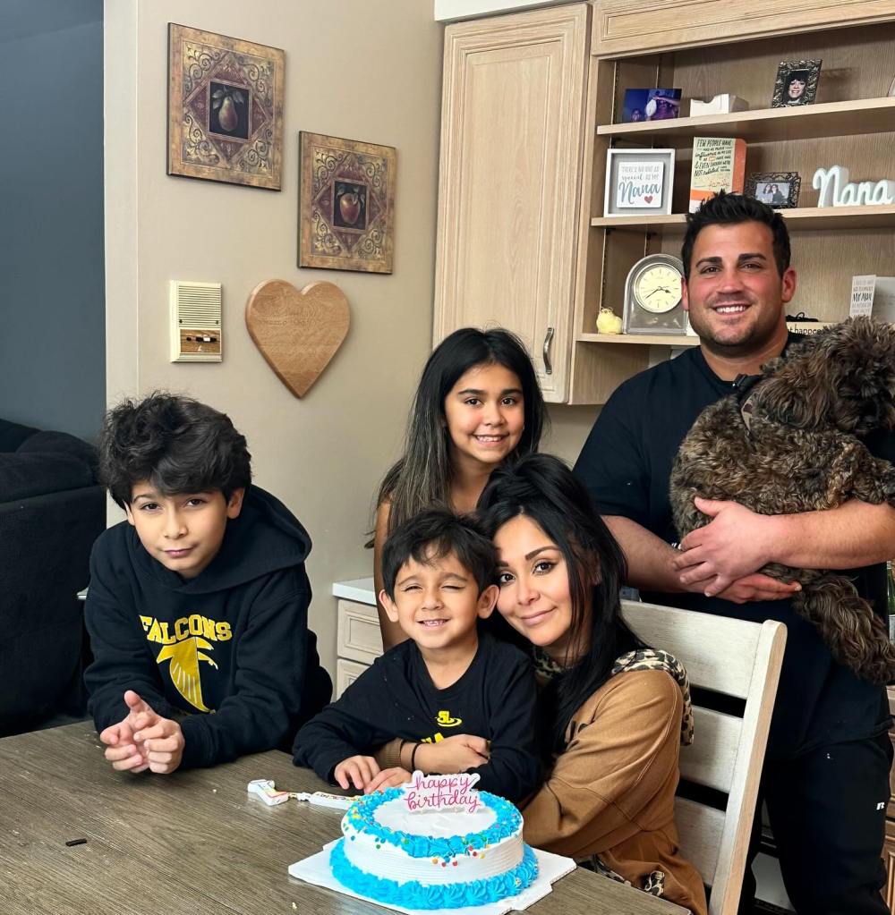 Snooki celebrating her 38th birthday with her family and a cake.