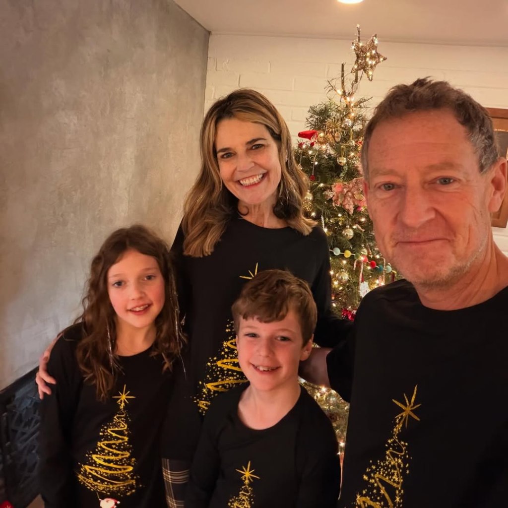 Savannah Guthrie with her family in front of a Christmas tree.