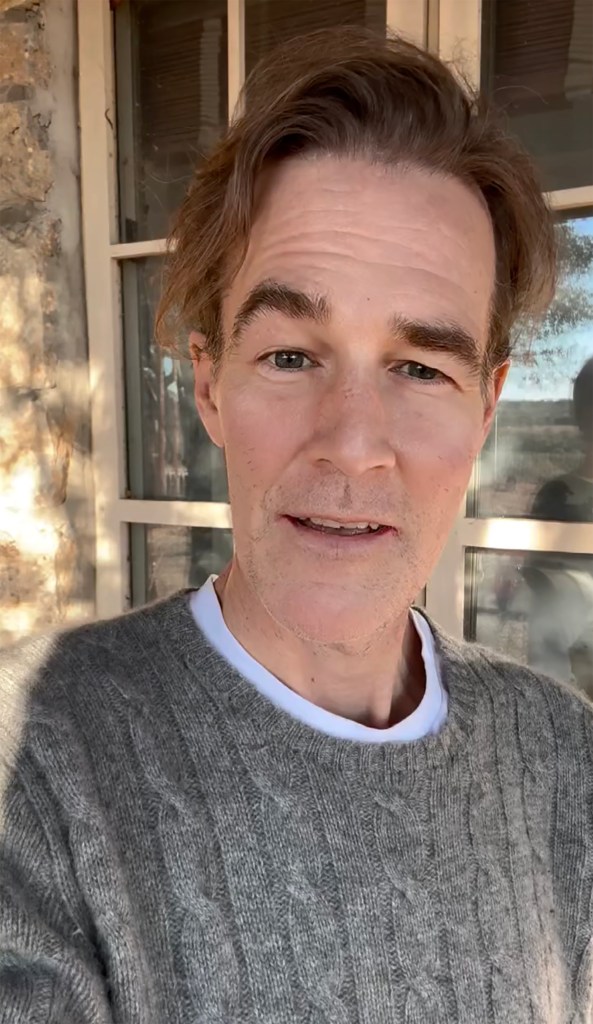 James Van Der Beek wearing a gray cable-knit sweater over a white t-shirt.