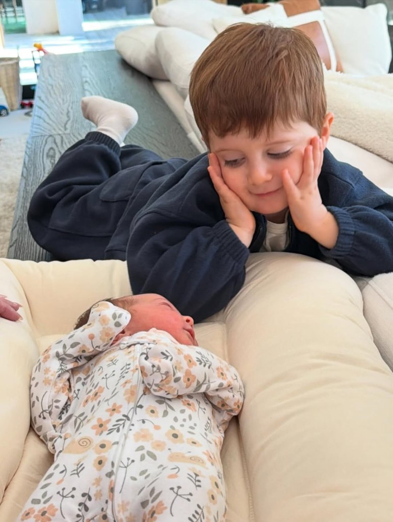 Meghan Trainor's son looking at his sister.