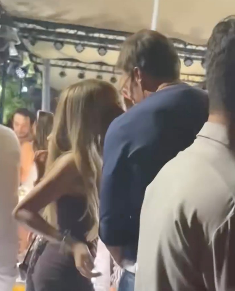 Alix Earle and Tom Brady at an event.