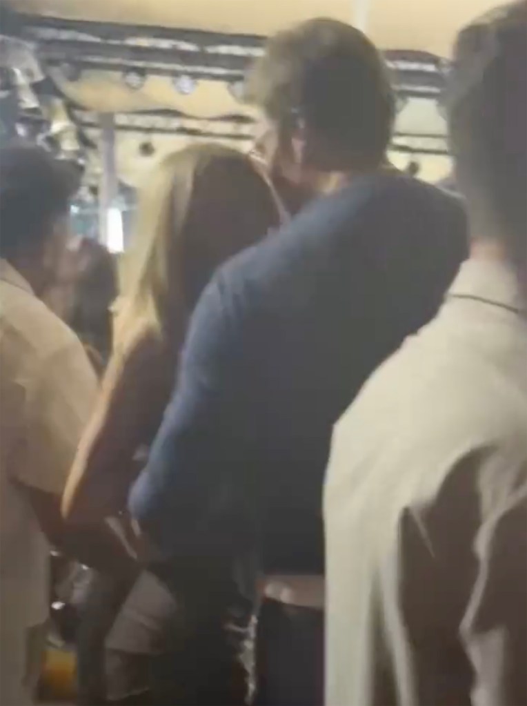 Tom Brady with Alix Earle at a party.