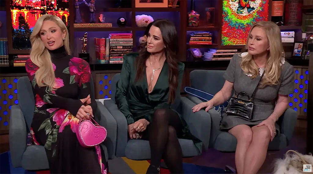 Paris Hilton, Kyle Richards, and Kathy Hilton sitting on chairs on a talk show.