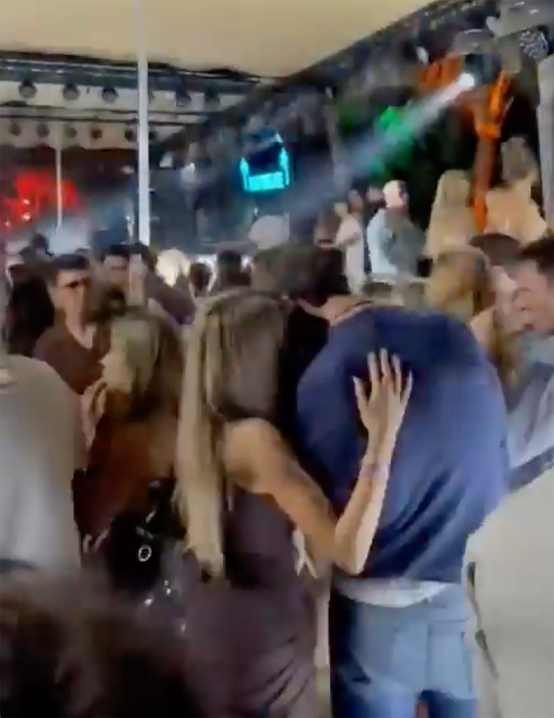 Alix Earle and Tom Brady dancing at a New Year's Eve party.