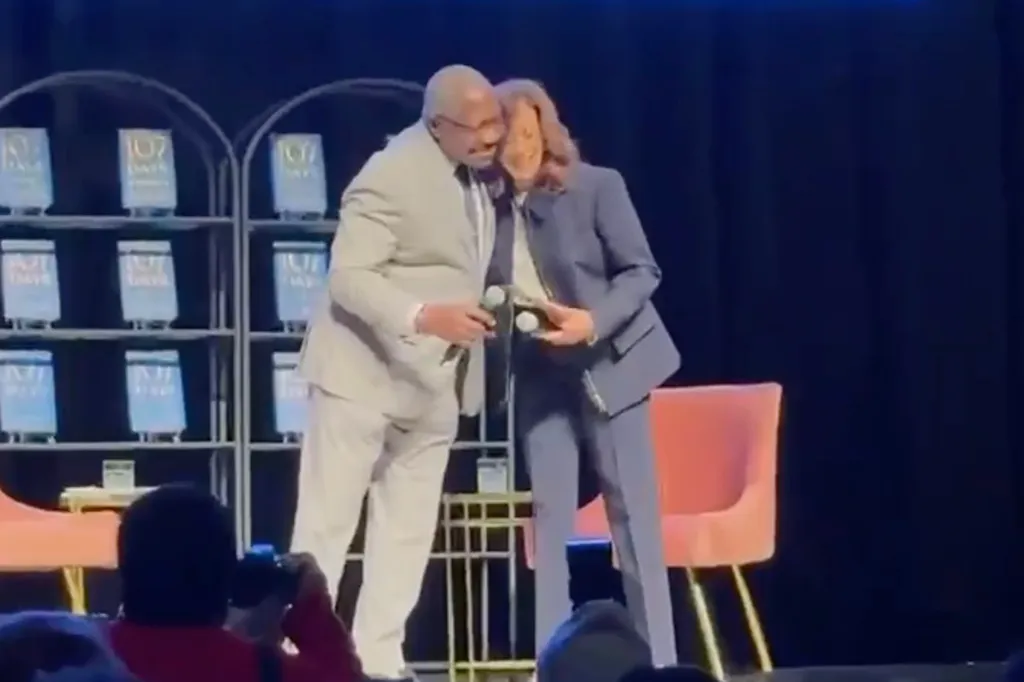 Kamala Harris hugging an unidentified man on stage.