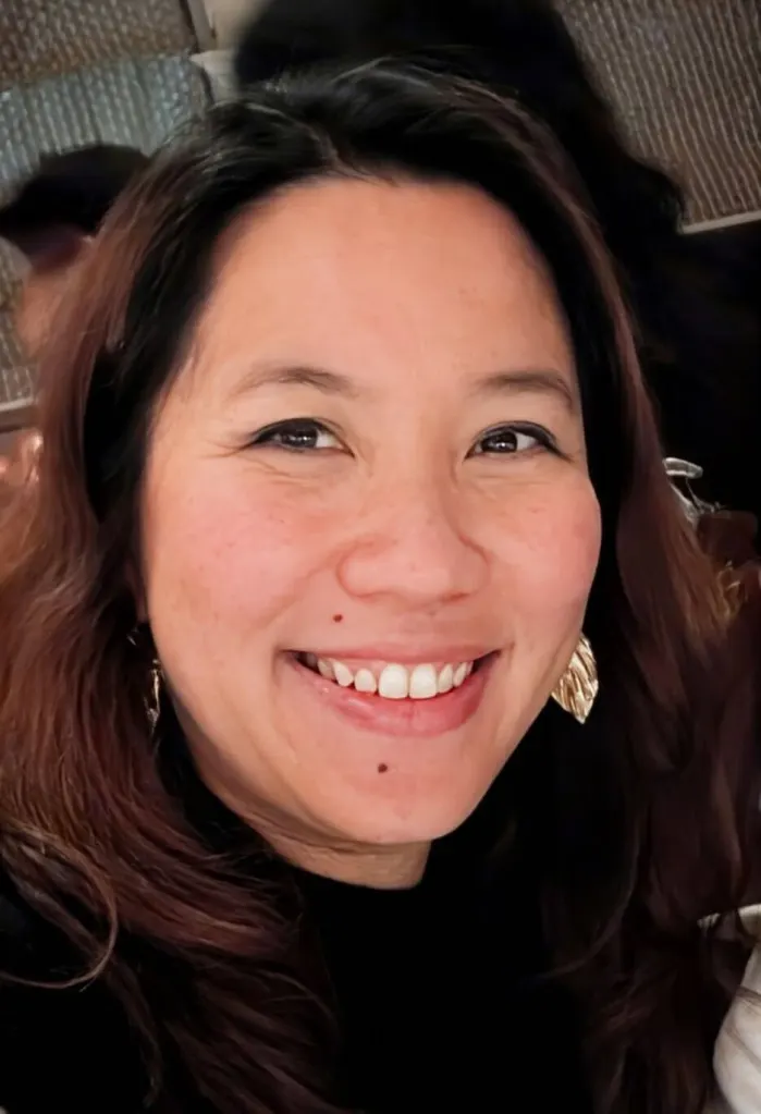 Yvonne Ng, whose daughter is in kindergarten at Braddock Drive Elementary School, smiles for a close-up photo.