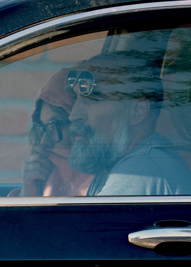 Annie Guthrie and Tommaso Cioni in a car.