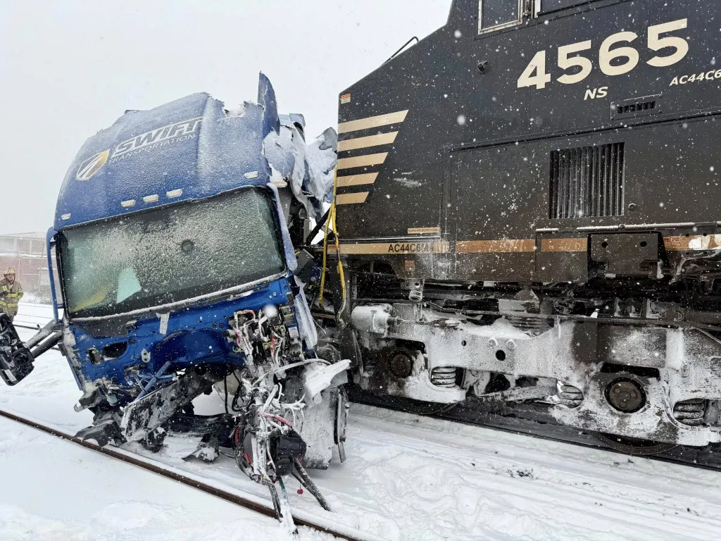 A semi-truck was struck by a freight train during a winter storm in Gastonia, North Carolina.