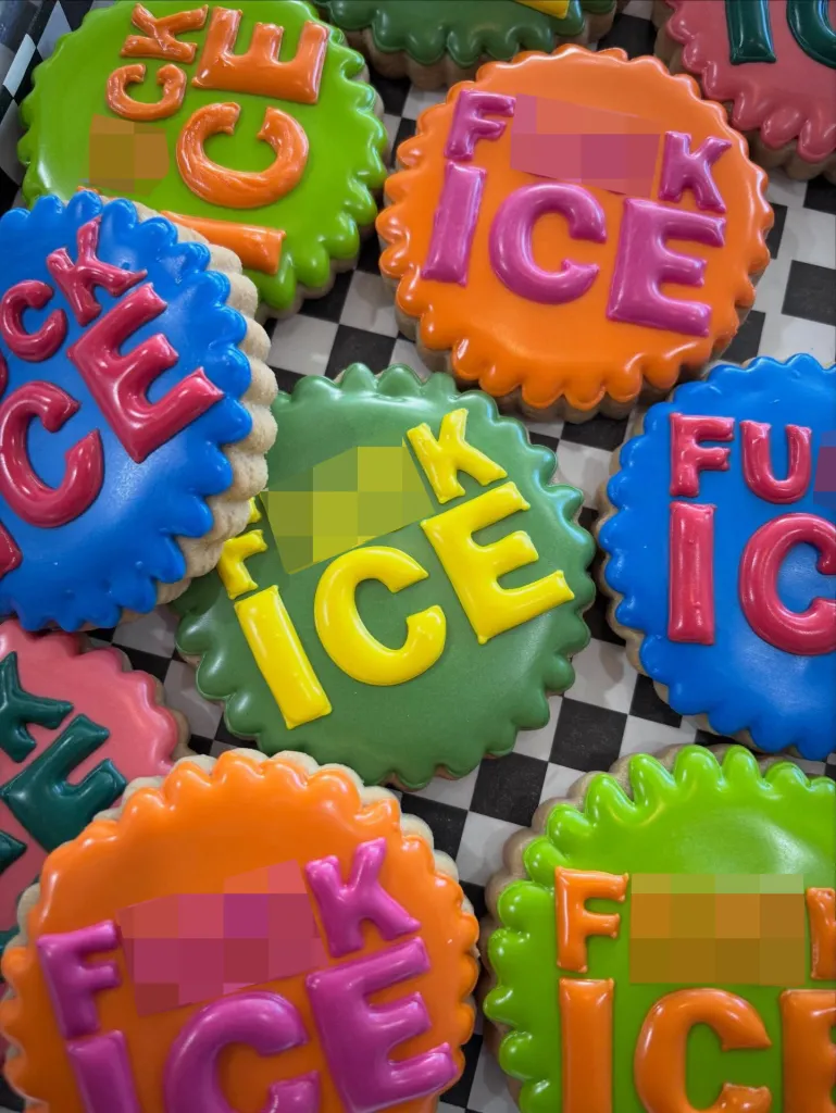 Sugar cookies with colorful icing that spell out 