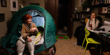 Russia Knocked Out the Heat. So She Slept in a Tent on Her Bed.