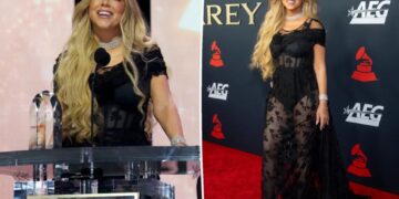 Mariah Carey rocks daring sheer dress while being honored at pre-Grammys gala