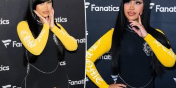 Cardi B takes a tumble while giving a robot a lap dance