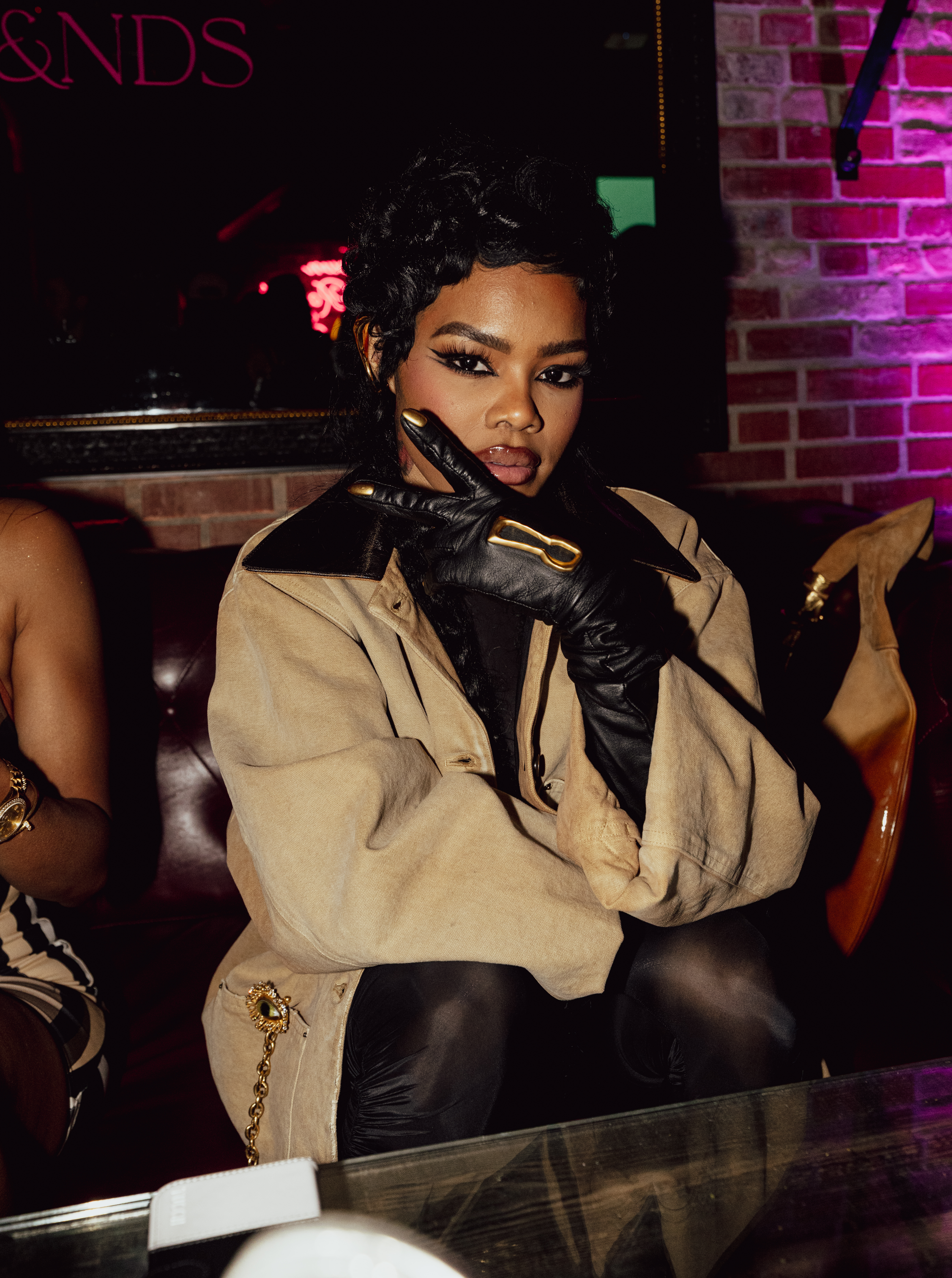 Teyana Taylor poses for a photo at a party.