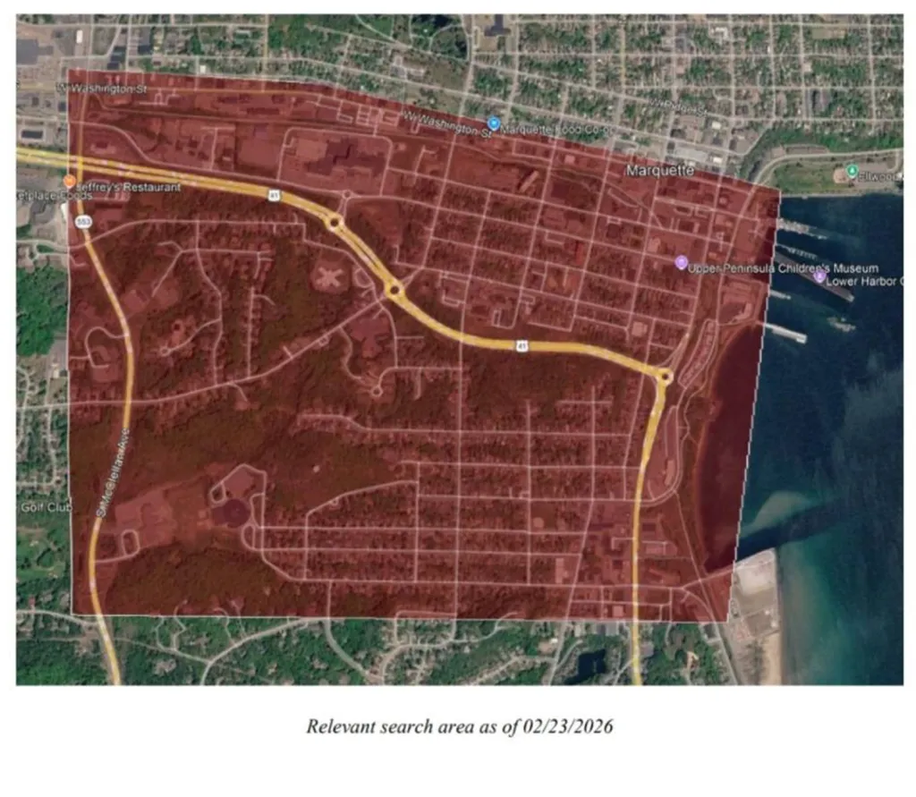 Satellite map of Marquette, Michigan, with a search area highlighted in red.