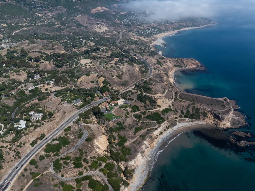 Aerial view of Rancho Palos Verdes, California, showing the Portuguese Bend neighborhood, coastline, and ocean.