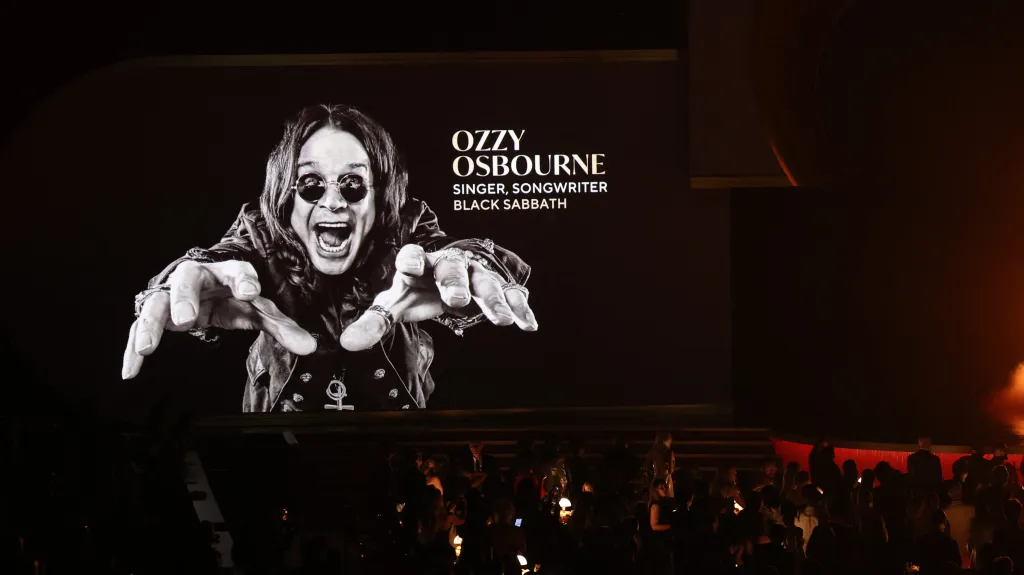 A screen displays a black and white image of Ozzy Osbourne during the In Memoriam segment at the Grammy Awards.