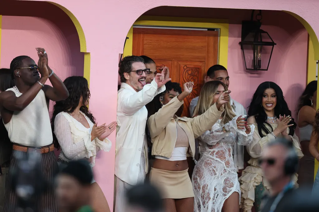 Pedro Pascal, Karol G, and Cardi B watch the Super Bowl LX Halftime Show.