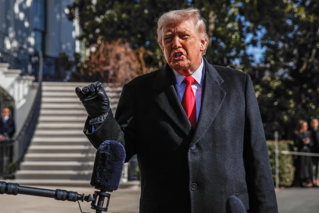Donald Trump speaking to reporters at the White House before departing.