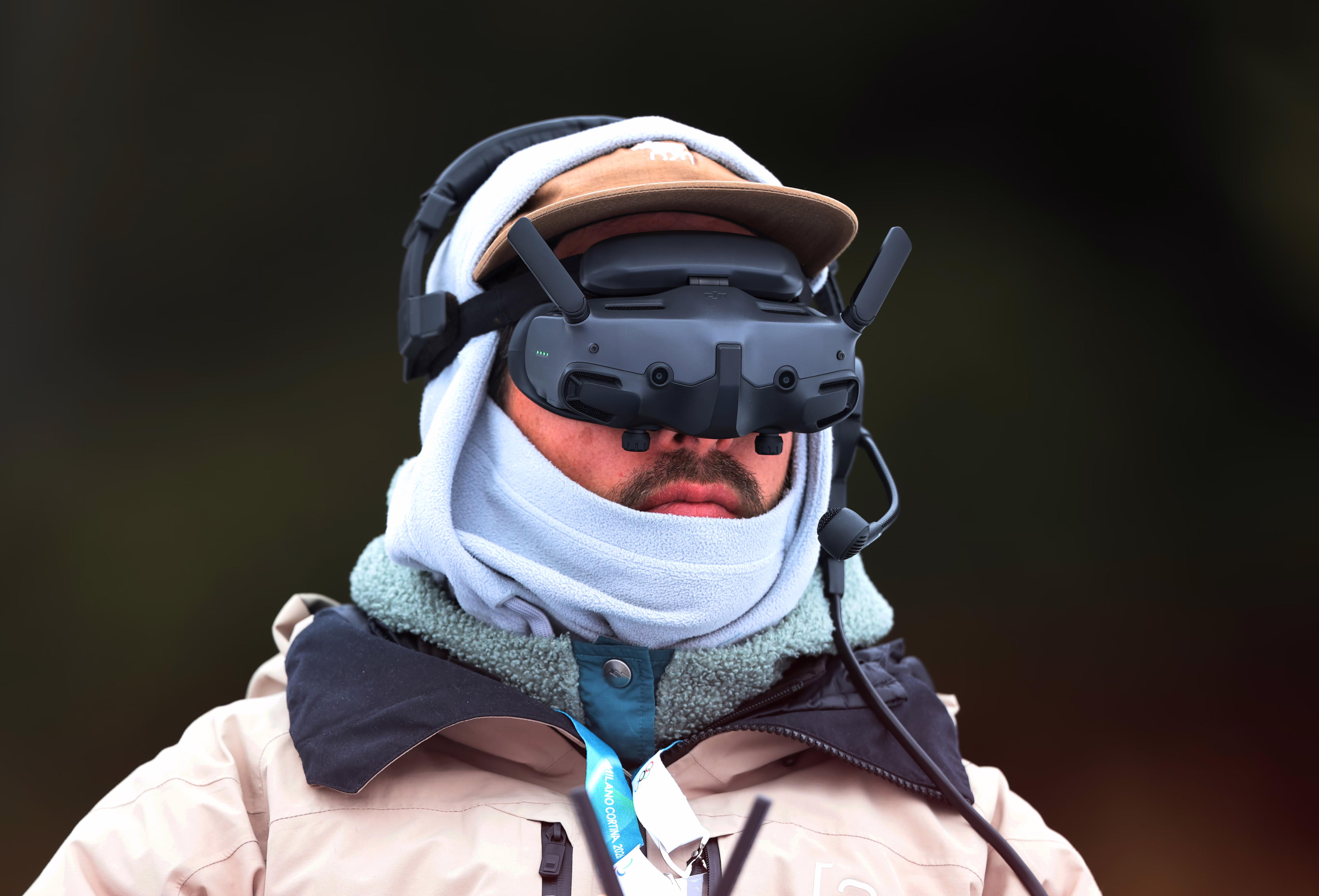 A drone operator wears a headset over his eyes.