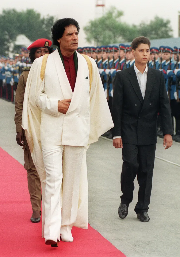 Khadafy and his son Seif al-Islam review troops on Sept. 3, 1989.