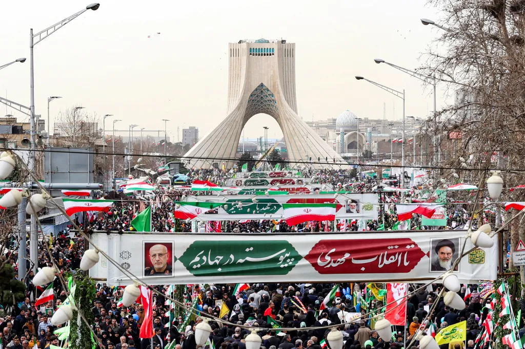 People marching near Azadi Tower in Tehran to mark the 47th anniversary of the 1979 Islamic revolution.