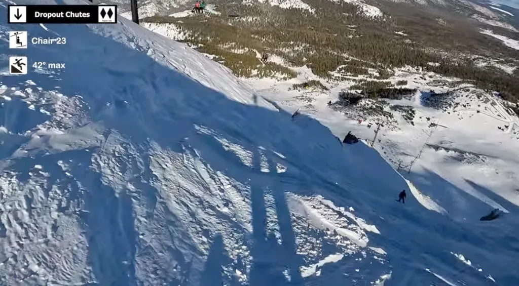 Aerial view of a steep snowy mountain with 