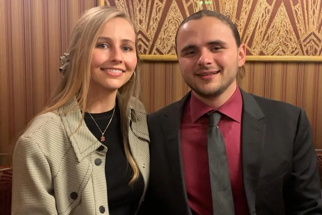 Molly Schirmang and Prince Michael Jackson posing together, smiling at the camera.