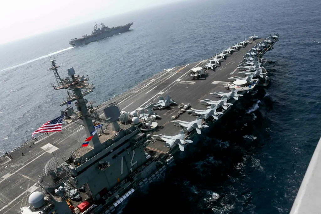 USS Abraham Lincoln and USS Kearsarge sailing in the Arabian Sea.