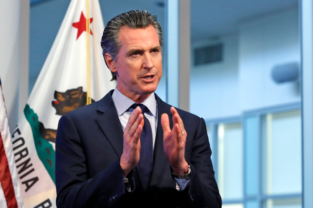 California Gov. Gavin Newsom speaking at a news conference.