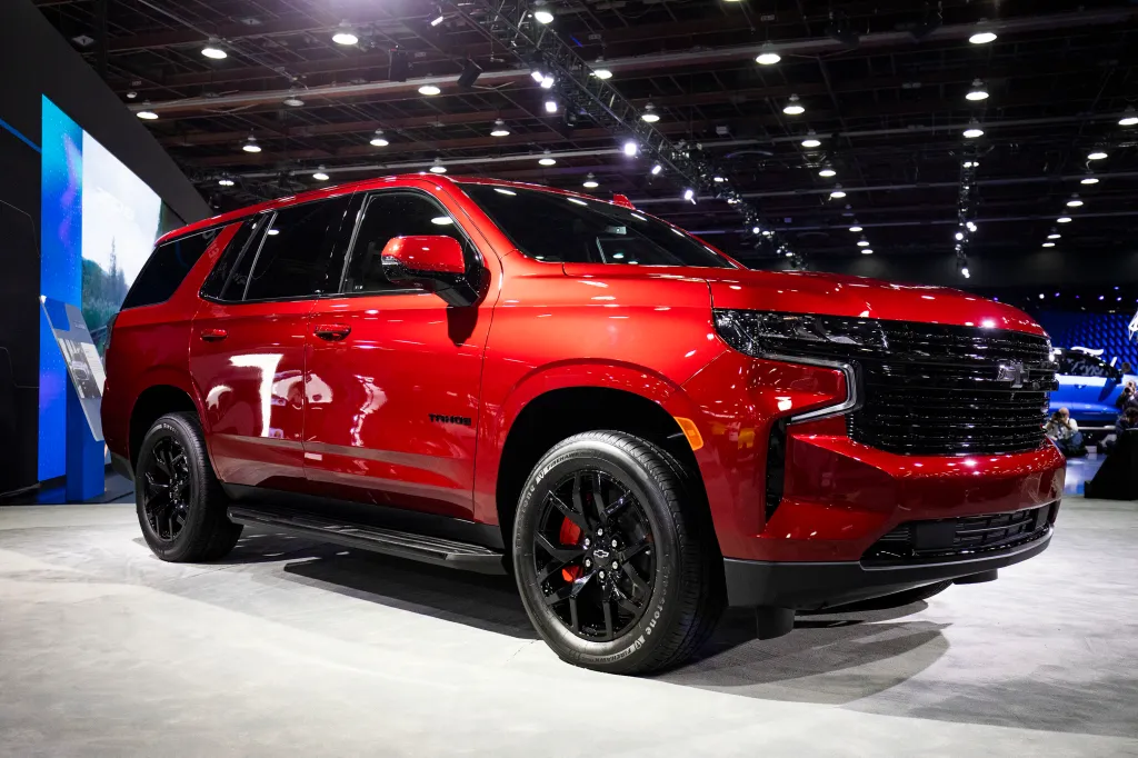 A red Chevrolet Tahoe is displayed at the 2022 North American International Auto Show.