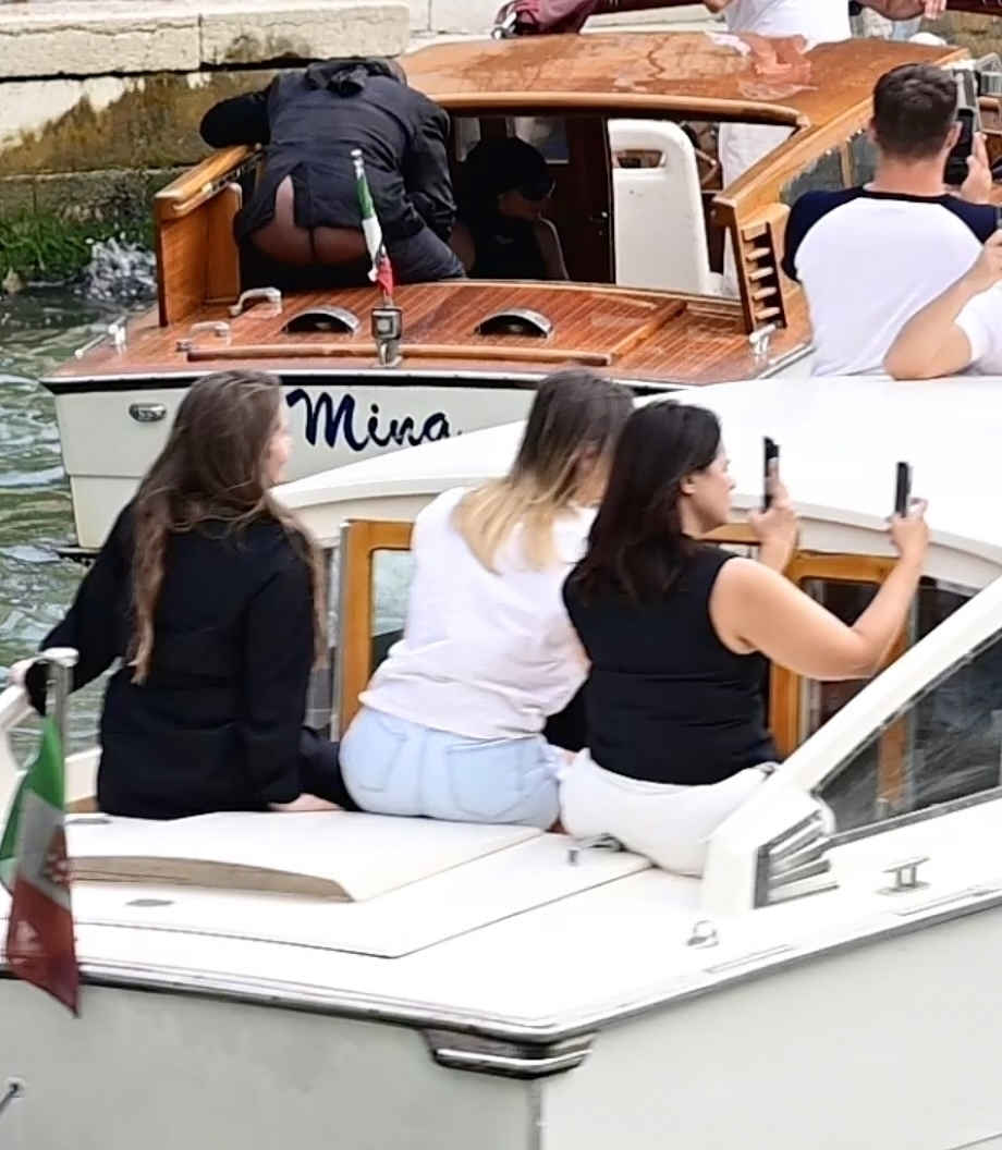 Kanye West exposes his buttocks while riding a water taxi with Bianca Censori.