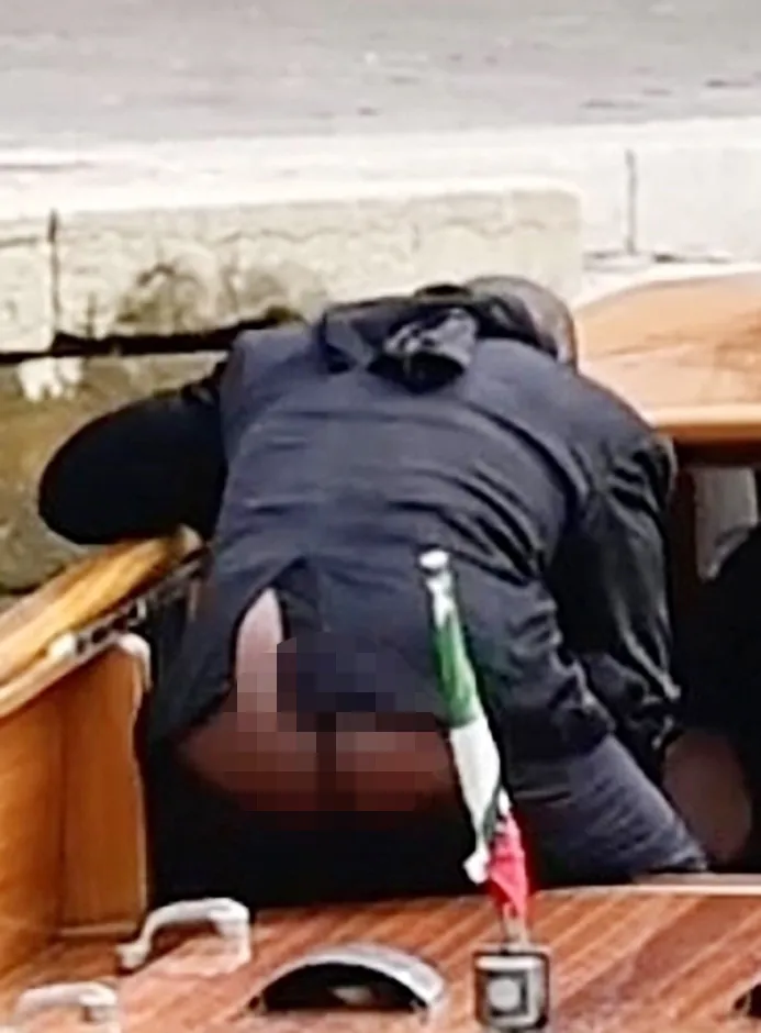 Kanye West's rear end exposed to onlookers during a river taxi ride.