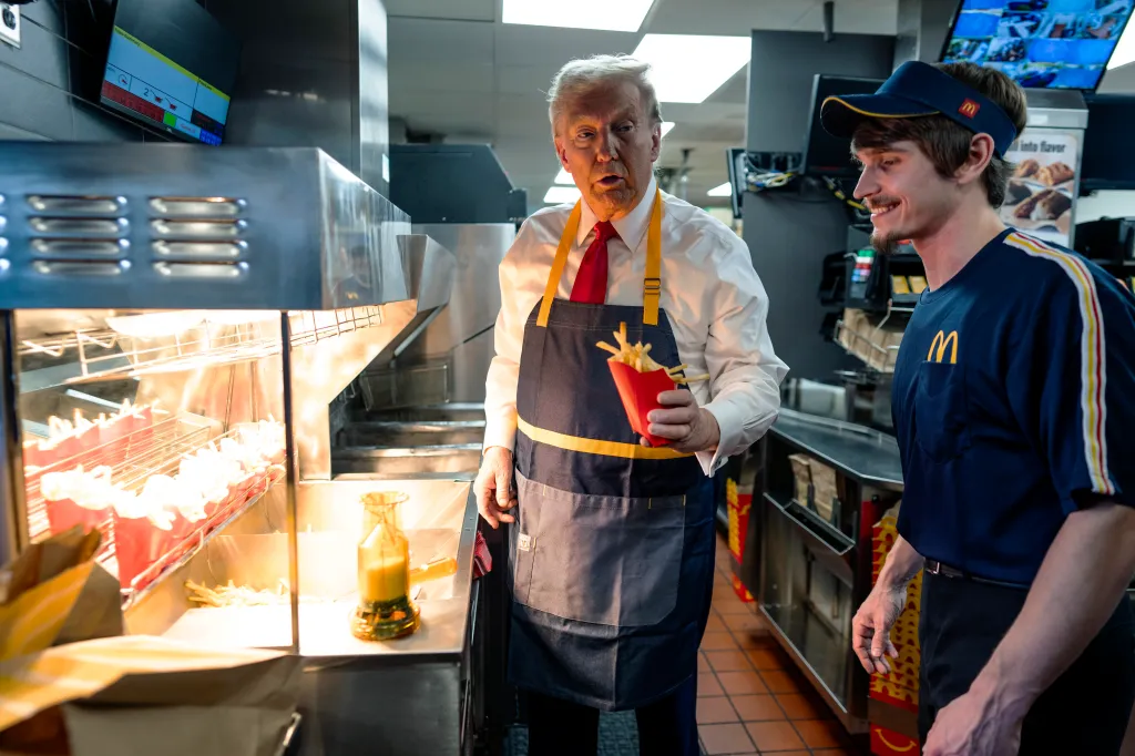 Donald Trump working behind the counter at a McDonald's restaurant.