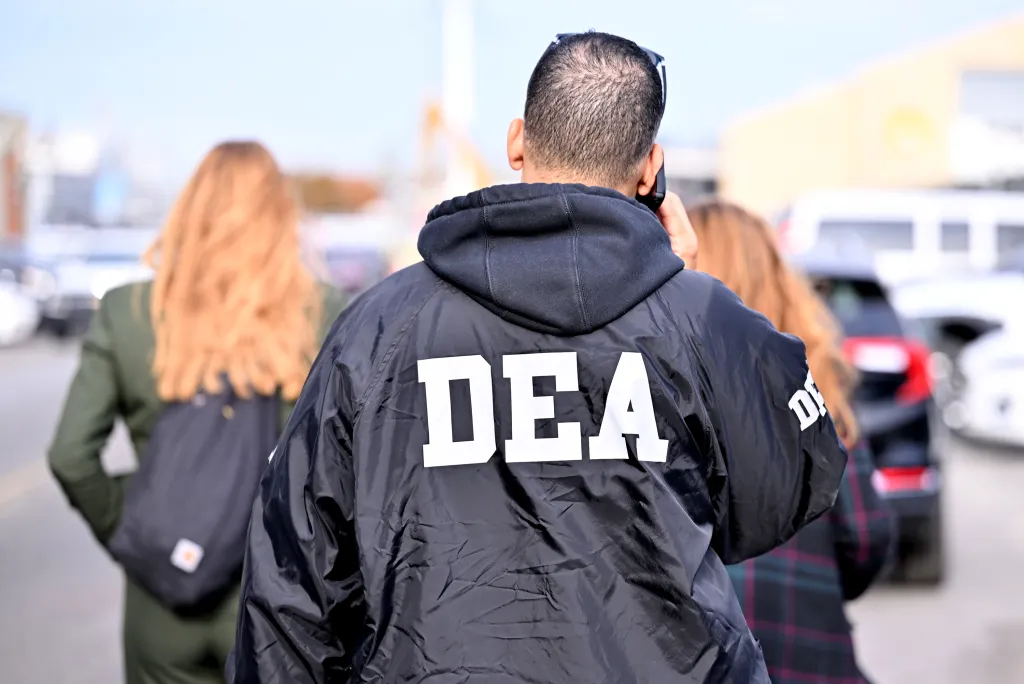 A person wearing a black jacket with 