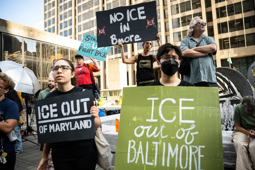Demonstrators hold signs in support of Kilmar Abrego Garcia outside the Immigration and Customs Enforcement (ICE) field office in Baltimore, Maryland, US, on Aug. 25, 2025