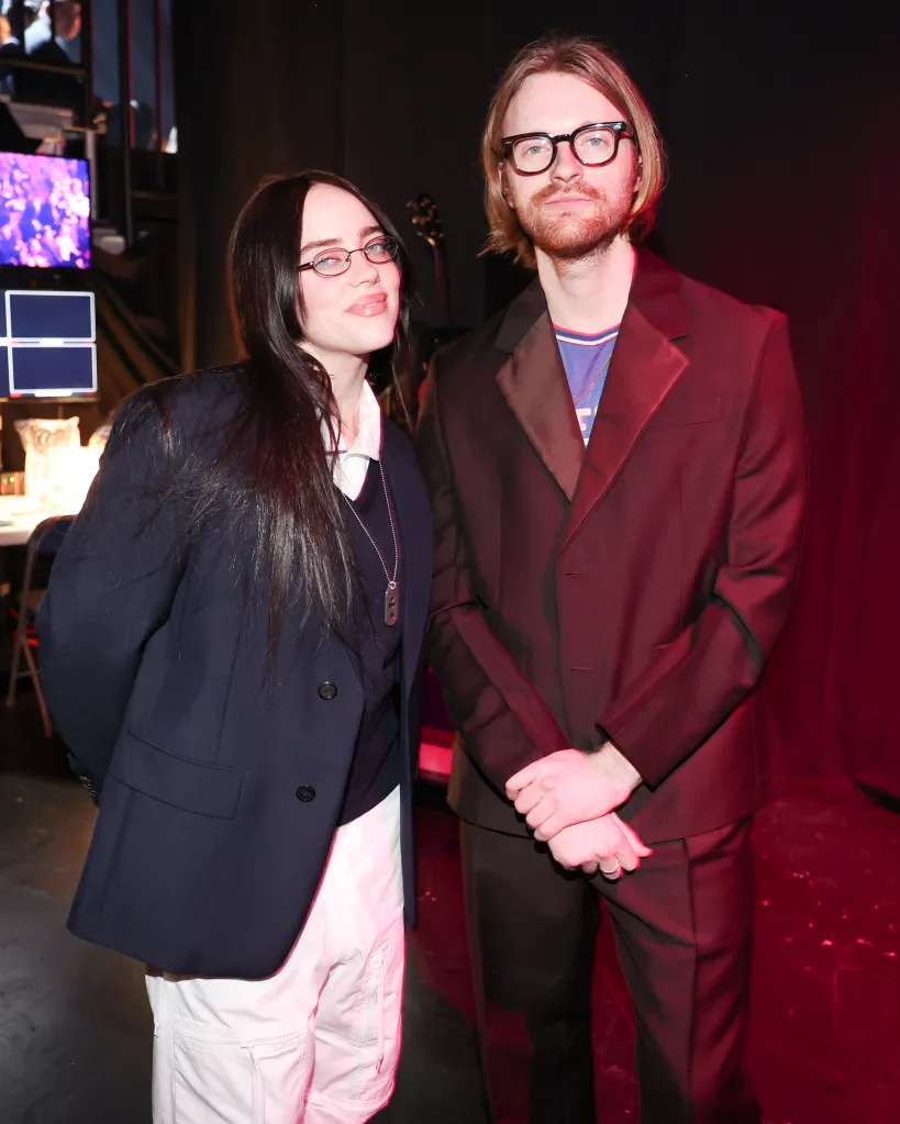 Billie Eilish and FINNEAS posing at the 2025 iHeartRadio Music Awards.